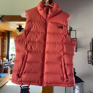 Pink and maroon north face puffer vest